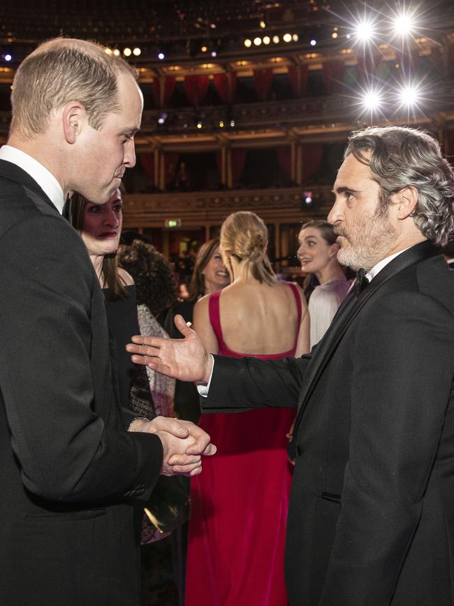 Prince William speaks with BAFTA winner Joaquin Phoenix at the awards. Picture: Getty