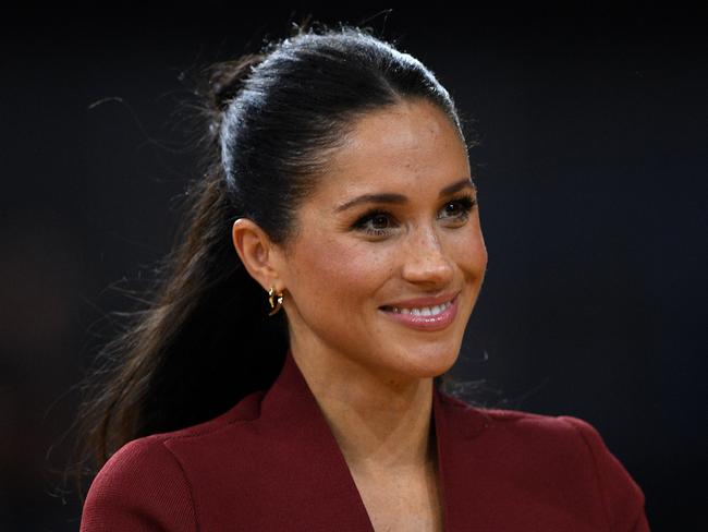 Meghan, the Duchess of Sussex is seen during the medal presentation following the Wheelchair Basketball Final at the Invictus Games in Sydney, Australia, Saturday, October 27, 2018. The Sydney Invictus Games, at which wounded or sick armed services personnel and veterans will compete, will run from Saturday, Oct 20 to Saturday, Oct 27. (AAP Image/Dan Himbrechts) NO ARCHIVING