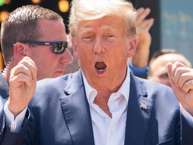 Former US President and 2024 presidential hopeful Donald Trump leaves after speaking at the Iowa State Fair in Des Moines, Iowa, on August 12, 2023. (Photo by Stefani Reynolds / AFP)