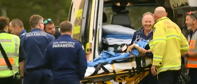 An injured firefighter is treated after battling the bushfires in northern NSW. Picture: ABC