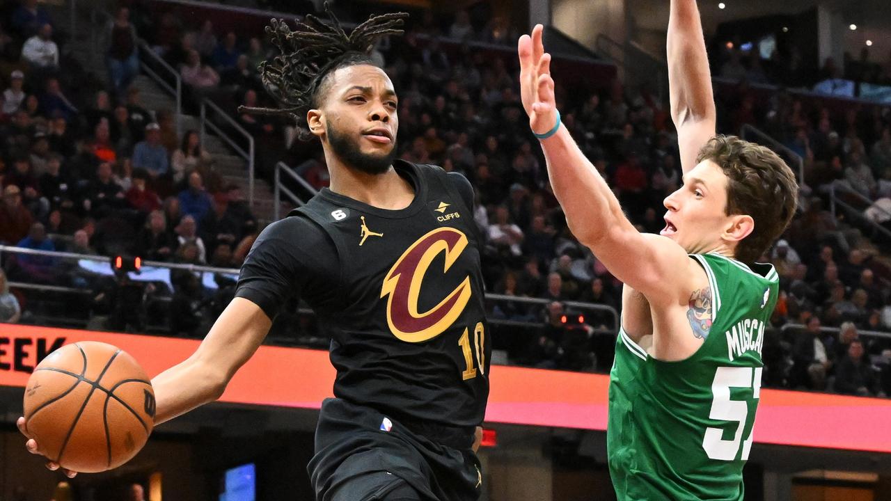 CLEVELAND, OHIO - MARCH 06: Darius Garland #10 of the Cleveland Cavaliers passes around Mike Muscala #57 of the Boston Celtics during the fourth quarter at Rocket Mortgage Fieldhouse on March 06, 2023 in Cleveland, Ohio. The Cavaliers defeated the Celtics 118-114 in overtime. NOTE TO USER: User expressly acknowledges and agrees that, by downloading and or using this photograph, User is consenting to the terms and conditions of the Getty Images License Agreement. (Photo by Jason Miller/Getty Images) *** BESTPIX ***