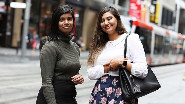 Sydney office workers Chhaya Chetty, 25, left, and Rhea Sharma, 28, say they have noticed an increase in staff returning to the CBD. Picture: Jane Dempster