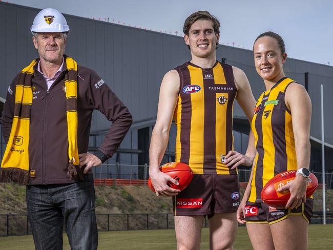 Hawthorn president Andy Gowers joins players Will Day and Jas Fleming at the new Hawthorn Dingley community centre. Picture: Jake Nowakowski