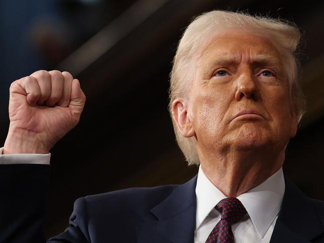 US President Donald Trump raises his fist as he addresses a joint session of Congress at the US Capitol in Washington, DC, on March 4, 2025. (Photo by Win McNamee / POOL / AFP)