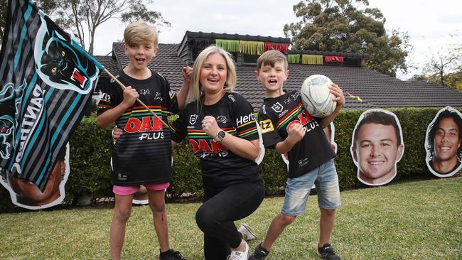 Panthers fan Anthea Strathdee with two of her kids Logan, 9, and Miller, 7. Picture: David Swift