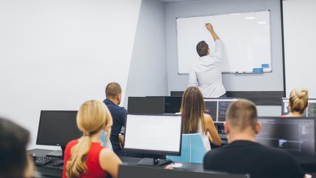 Modern teaching, teacher, technology, ipad, computers.  People in a computer seminar.school of computers.Students in the classroom. Picture: istock