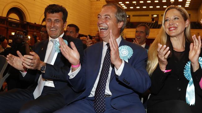 Nigel Farage applauds as the count shows massive gains for his new Brexit Party. Picture: AP.