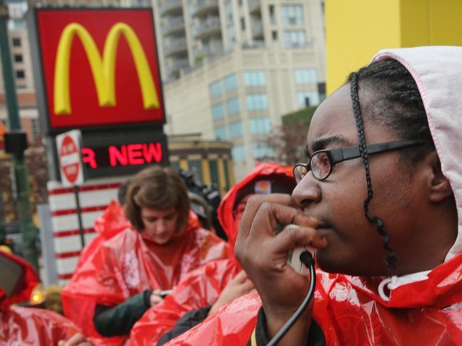 CHICAGO, IL - MAY 15: Fast food workers and activists demonstrate outside McDonald's downtown flagship restaurant on May 15, 2014 in Chicago, Illinois. The demonstration was one of several nationwide calling for wages of $15 per hour and better working conditions for fast food workers. Scott Olson/Getty Images/AFP== FOR NEWSPAPERS, INTERNET, TELCOS & TELEVISION USE ONLY ==