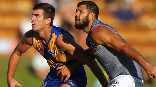 Scott Lycett of the Eagles and Patrick Ryder of the Power contest the ruck.