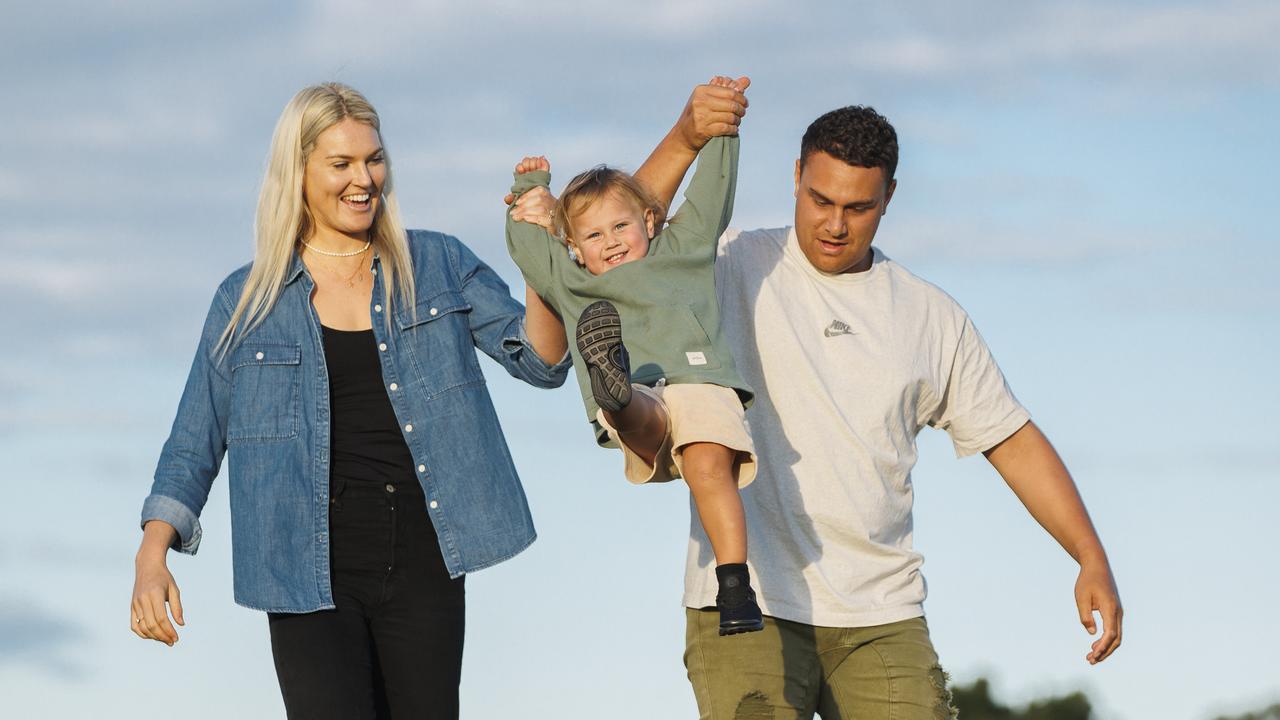 Firebirds star Gretel Bueta, who is expecting her second child, with husband Niko and son Bobby, 21 months. Picture Lachie Millard