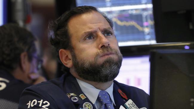 A trader watches as US indexes sink. Pic: AP