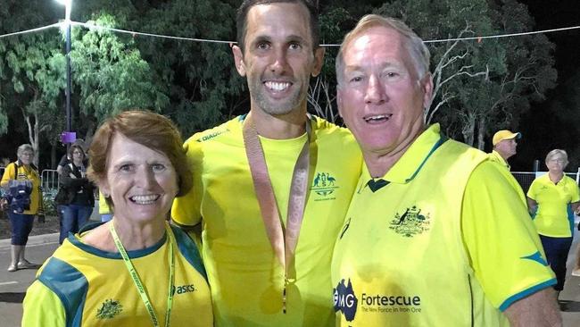 STAUNCH SUPPORTERS: Proud parents Barb and Ryan Knowles celebrate with Mark after his gold-medal win. Picture: CONTRIBUTED