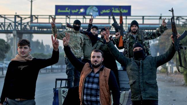 Syrian rebel fighters at the town of Homs, 40km south of Hama, a critically important junction controlling the M5 and the east-west M1 highway that links Damascus and central Syria to the coast, and dominating Syria’s heavily populated central breadbasket. Picture: Aaref Watad / AFP