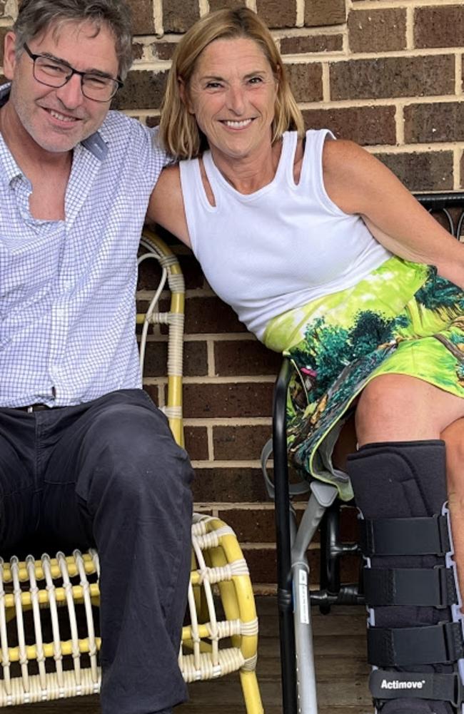 Kerry Deague with her injured leg in a boot. She is pictured with her brother. Picture: Supplied