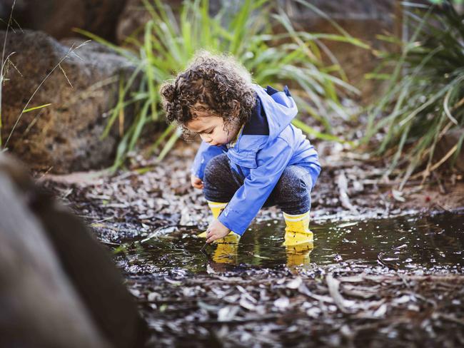 Etienne loves playing in all the muddy bits at the park. Picture- Nicole Cleary