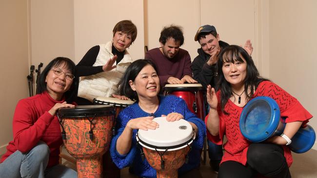 Izumi Nago with music therapy students (L to R) Yasco Pierce, Michie Spain, Tachi, Luke Abdullah and Phillip Pogossov at her studio in Pennant Hills Tuesday July 24, 2018. She runs music classes for kids with disabilities. (AAP IMAGE/Simon Bullard)