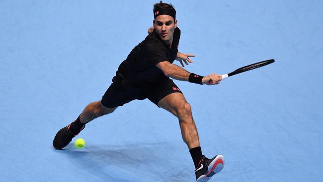 Federer of Switzerland stretches to play a backhand in his singles match against Novak Djokovic in 2019. Picture: Justin Setterfield/Getty Images