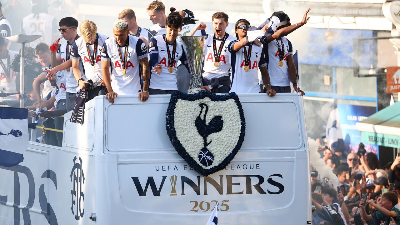 The team celebrates with fans and show off the first victory trophy the Tottenham Hotspurs have won in 17 years. Picture: Peter Nicholls / Getty Images