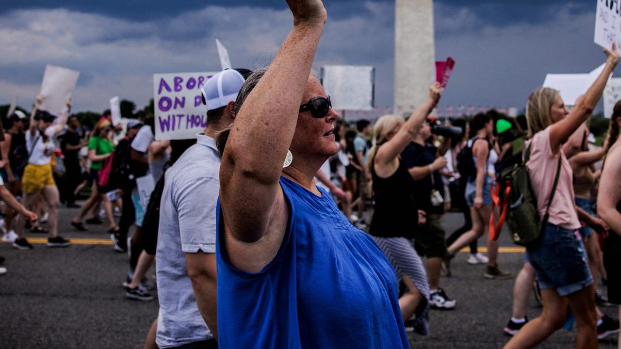 Abortion rights activists march past the Washington Monument. Picture: Samuel Corum/AFP