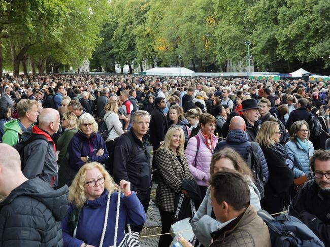 LONDON, ENGLAND - SEPTEMBER 17: Members of the public queue in front of Westminster Hall on September 17, 2022 in London, England. Queen Elizabeth II's grandchildren mount a family vigil over her coffin lying in state in Westminster Hall. Queen Elizabeth II died at Balmoral Castle in Scotland on September 8, 2022, and is succeeded by her eldest son, King Charles III. (Photo by Chris Jackson/Getty Images)