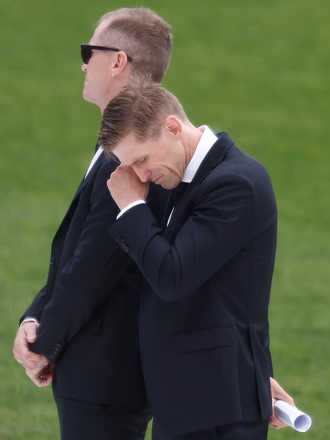 Scott Selwood sheds a tear during alongside Adam at Troy’s funeral in February. Picture: Michael Willson/AFL Photos