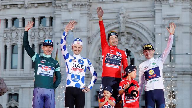 Kaden Groves, Jay Vine, Primoz Roglic and Mattias Skjelmose celebrate on the podium after the last stage of the Vuelta a Espana. Picture: Oscar Del Pozo / AFP