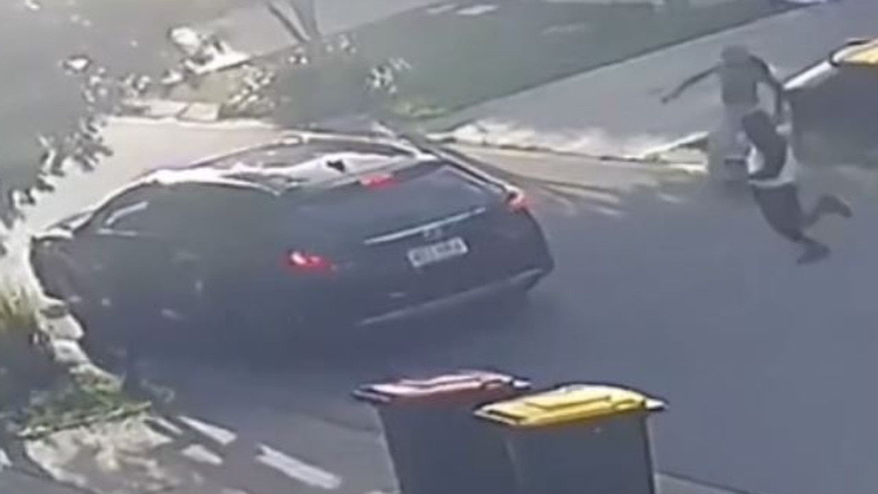 A knife or machete waved from the car driven away from the Rochedale South home