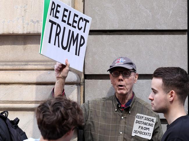 A Trump supporter holds a sign outside Trump Tower. Picture: Getty Images via AFP