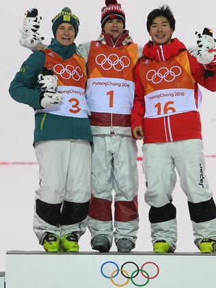 (L-R) Matt Graham of Australia, Mikael Kingsbury of Canada and Daichi Hara of Japan stand on the podium after winning the silver, gold and bronze medals in the Men's Moguls Final at Phoenix Snow Park during the PyeongChang 2018 Winter Olympic Games, in PyeongChang, South Korea, Monday, February 12, 2018. (AAP Image/Dan Himbrechts) NO ARCHIVING, EDITORIAL USE ONLY