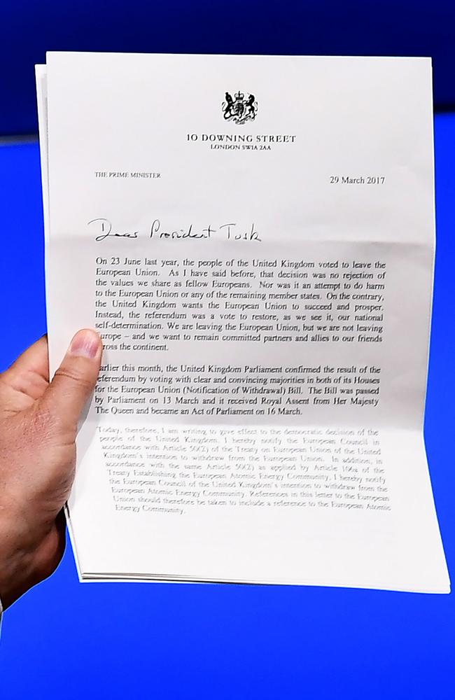 European Council President Donald Tusk holds British Prime Minister Theresa May's formal notice of the UK's intention to leave the EU. Picture: AFP/Pool/Emmanuel Dunand