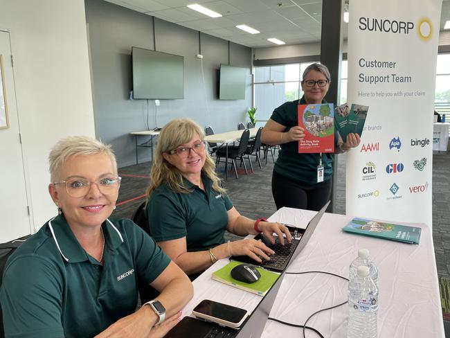 Suncorp staff members Romany Jones, Kim Borkowski and Vicki Kerby  are ready offer assistance at the Insurance Hub, established at the Townsville Sports Stadium in Annandale. Photo: Leighton Smith.