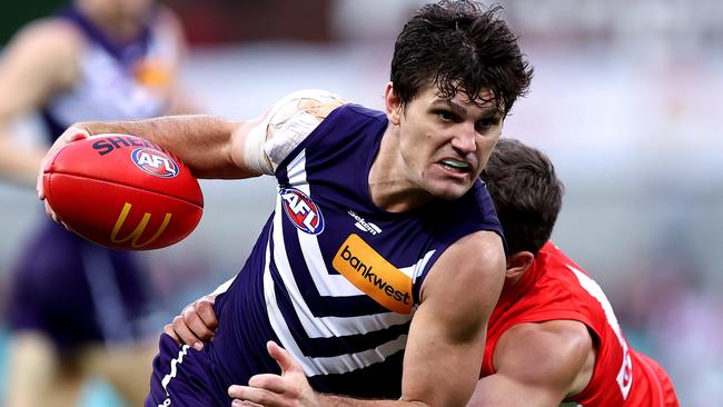 SYDNEY, AUSTRALIA - MAY 13: Lachie Schultz of the Dockers competes with Oliver Florent of the Swans during the round nine AFL match between Sydney Swans and Fremantle Dockers at Sydney Cricket Ground, on May 13, 2023, in Sydney, Australia. (Photo by Brendon Thorne/AFL Photos/Getty Images)