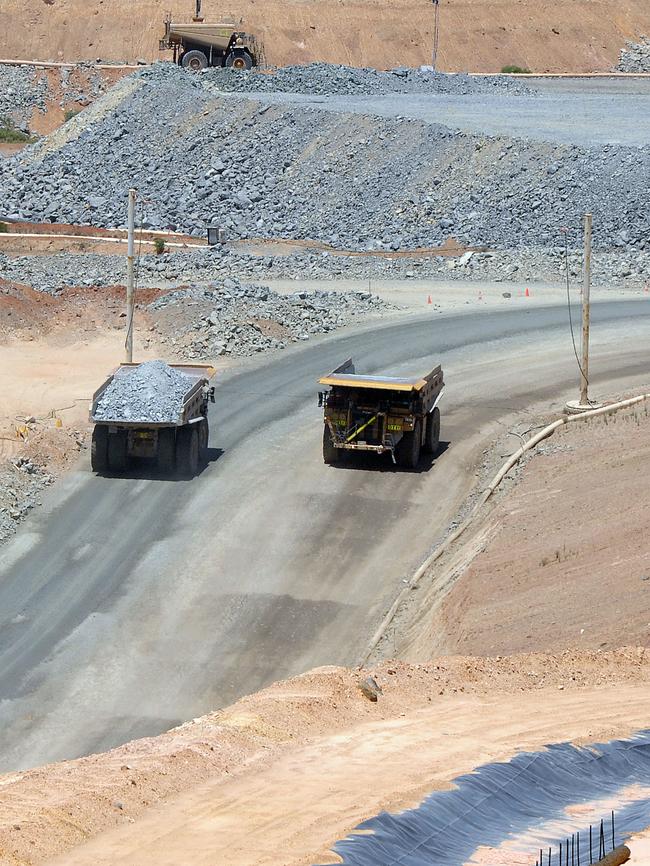 Earth moving trucks pass each other in the southern pit of Newmont's Boddington Gold mine, in Western Australia. Picture: Carla Gottgens/Bloomberg