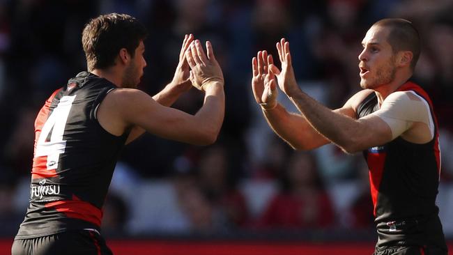 Kyle Langford and David Zaharakis celebrate a Bombers goal. Pic: AAP