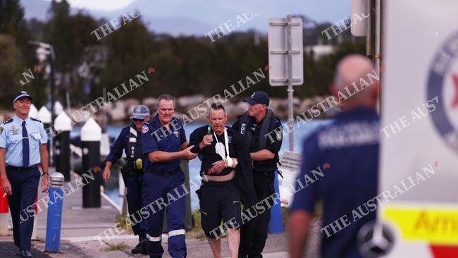 An injured crew member is loaded into an ambulance in Batemans Bay. Picture: Alex Coppel