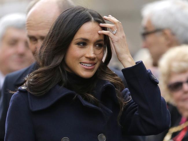 Meghan Markle, fiancee of Britain's Prince Harry, arrives at the Contemporary Centre for a Terrence Higgins Trust World AIDS Day charity fair in Nottingham, England , Friday, Dec. 1, 2017. It was announced on Monday that Prince Harry and American actress Meghan Markle are engaged and will marry in the spring of 2018. (AP Photo/Alastair Grant)