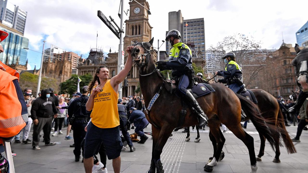 Shocking photos of last month’s protest included one of a man trying to push away a police horse. Picture: AFP.