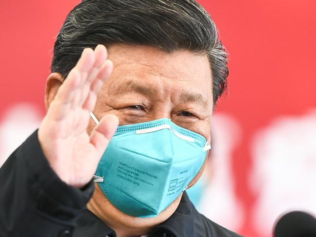 This photo released on March 10, 2020 by China's Xinhua News Agency shows Chinese President Xi Jinping wearing a mask as he waves to a coronavirus patient and medical staff via a video link at the Huoshenshan hospital in Wuhan, in China's central Hubei province on March 10, 2020. (Photo by Xie Huanchi / XINHUA / AFP) / China OUT - Hong Kong OUT - Japan OUT - Germany OUT - United States OUT - United Kingdom OUT / -----EDITORS NOTE---- RESTRICTED TO EDITORIAL USE - ONE TIME USE - MANDATORY CREDIT "AFP PHOTO/XINHUA / XIE HUANCHI" - NO MARKETING NO ADVERTISING CAMPAIGNS - DISTRIBUTED AS A SERVICE TO CLIENTS - NO ARCHIVES /