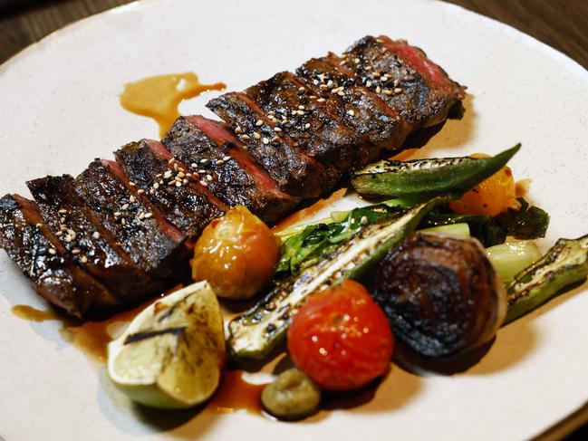 The Schottlander's Wagyu steak striploin with yuzu kosho, gai lan, yakiniku sauce at Kyubi restaurant at Campbelltown Catholic Club. Picture: Richard Dobson