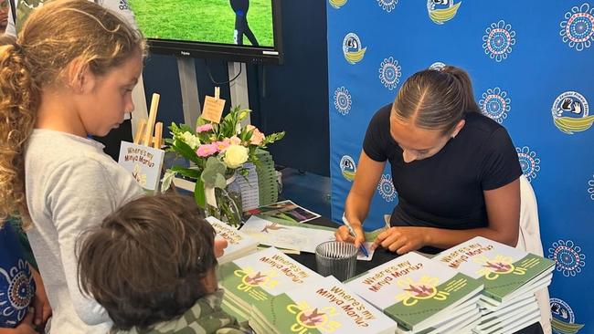 Speed signing copies of her book at the launch. Picture: Indigenous Literacy Foundation