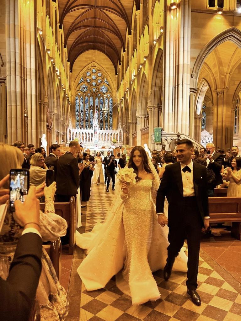 Stephen Coniglio and Rebecca Demlakian wed in Sydney’s St Mary’s Cathedral.