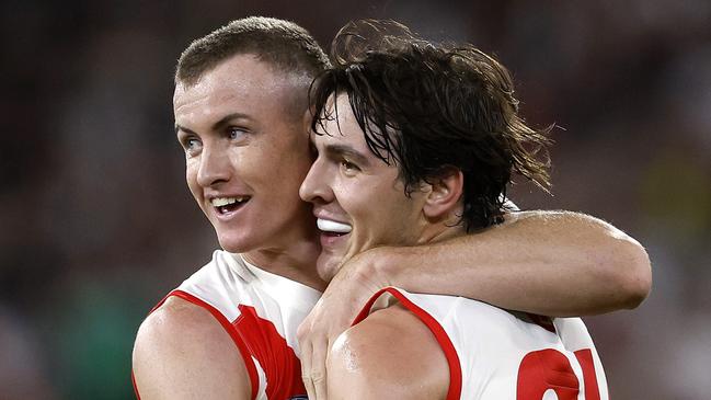 Sydney's Chad Warner and Errol Gulden celebrate setting up a goal to Logan McDonald during the Round 1 AFL match between the Collingwood Magpies and the Sydney Swans at the MCG on March 15, 2024. Photo by Phil Hillyard(Image Supplied for Editorial Use only - Phil Hillyard  **NO ON SALES** - Â©Phil Hillyard )