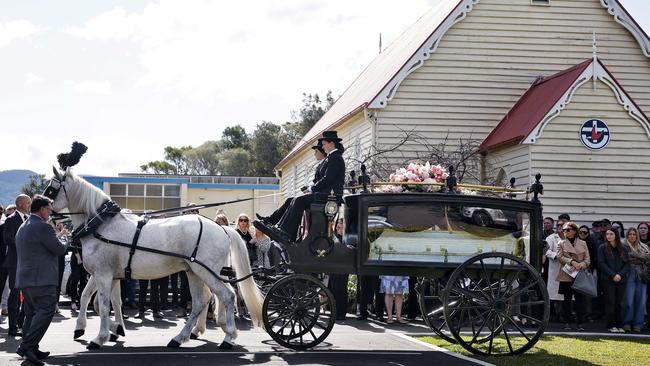 Family and friends gather at the funeral of Brooke Sorlie as her casket arrives by horse and carriage. Picture: Sam Ruttyn