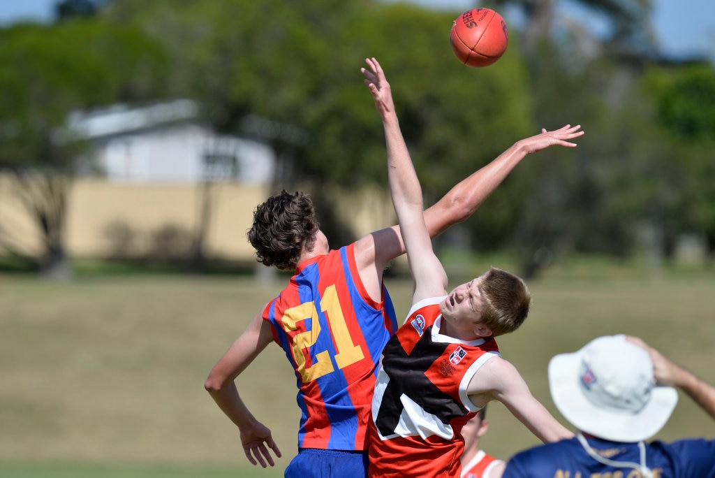 Sam Gillespie (right) of Our Lady of the Southern Cross College and Lachlan Tonscheck of Downlands College in AFL Queensland Schools Cup Darling Downs round at Captain Cook ovals, Friday, April 27, 2018. Picture: Kevin Farmer