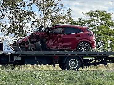 Chaotic three car crash leaves police vehicle in ditch, two injured