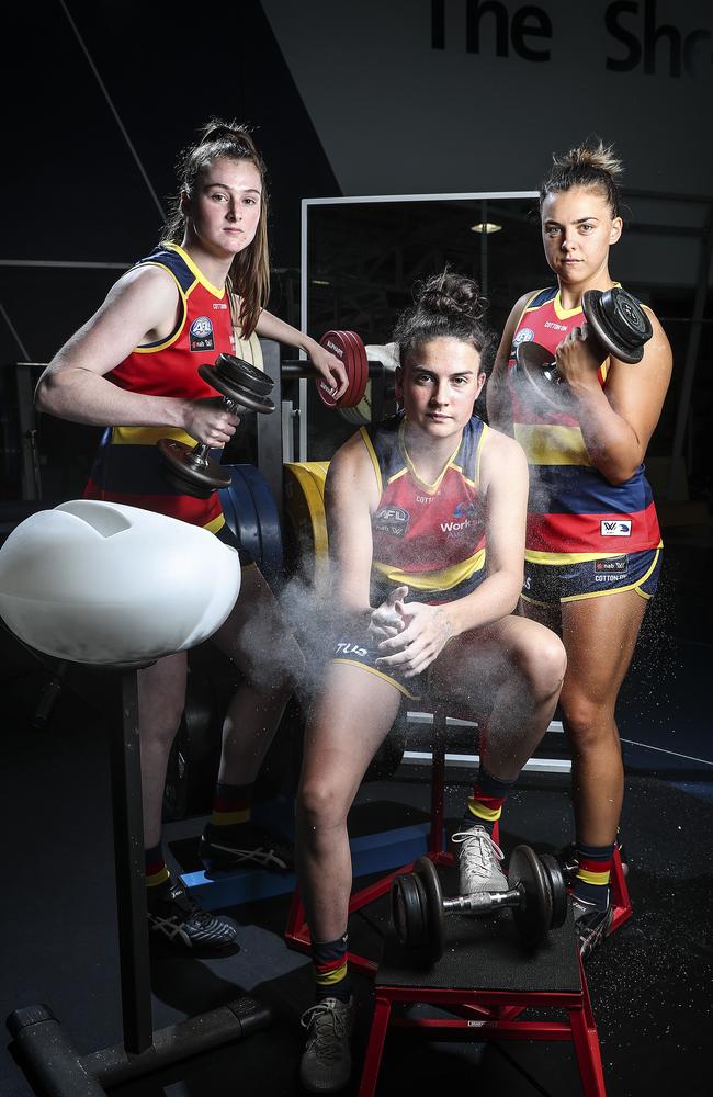 Adelaide Crows players Sarah Allan, Eloise Jones and Ebony Marinoff in the West Lakes gym, ready for the season kick-off. Picture: Sarah Reed