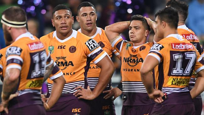 Broncos players reacts after a Storm try. Picture: AAP