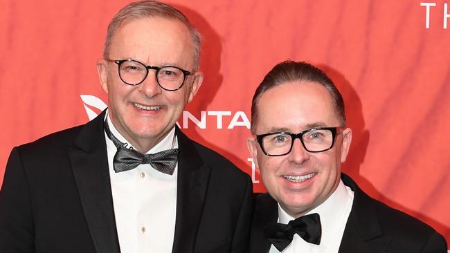 Australian Prime Minister Anthony Albanese (L) stands with Qantas CEO Alan Joyce as they attend the Qantas 100th Gala Dinner at Jetbase 96 hangar at Sydney's International Airport on March 31, 2023 in Sydney, Australia.