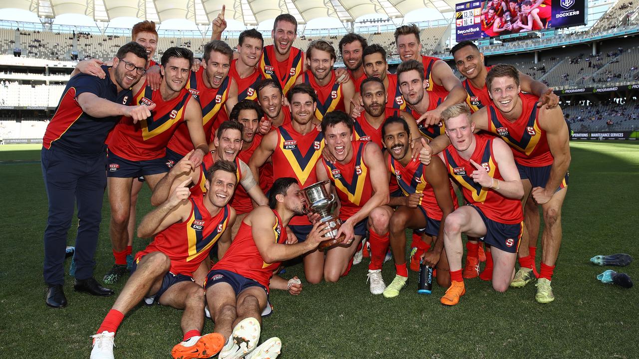 PERTH, AUSTRALIA - MAY 12: The SANFL team pose with the Haydn Bunton Jnr Cup after winning the state game between WA and SA at Optus Stadium on May 12, 2019 in Perth, Australia. (Photo by Paul Kane/Getty Images)