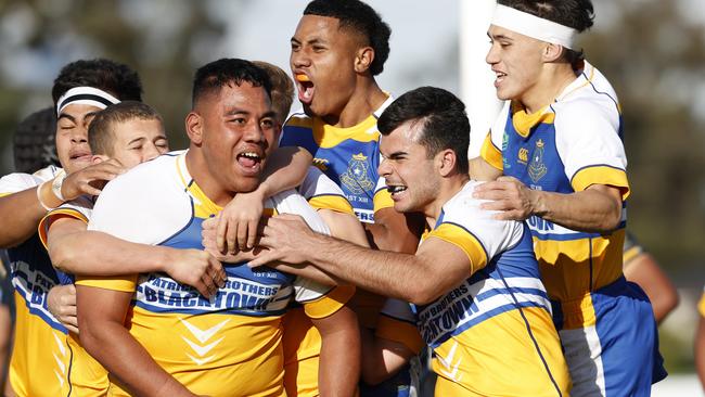 Tevita Alatini celebrating his try with Patrician Brothers Blacktown teammates in their victory over Westfields SHS. Picture: Jonathan Ng